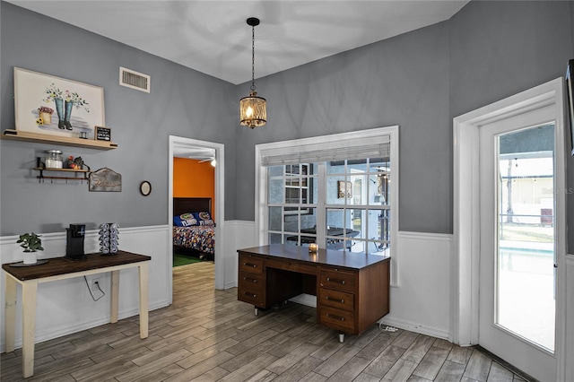 office area with ceiling fan and light hardwood / wood-style floors