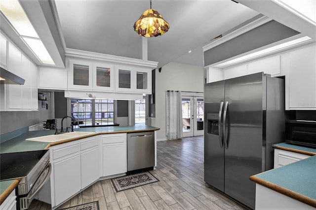 kitchen with pendant lighting, sink, white cabinets, stainless steel appliances, and french doors