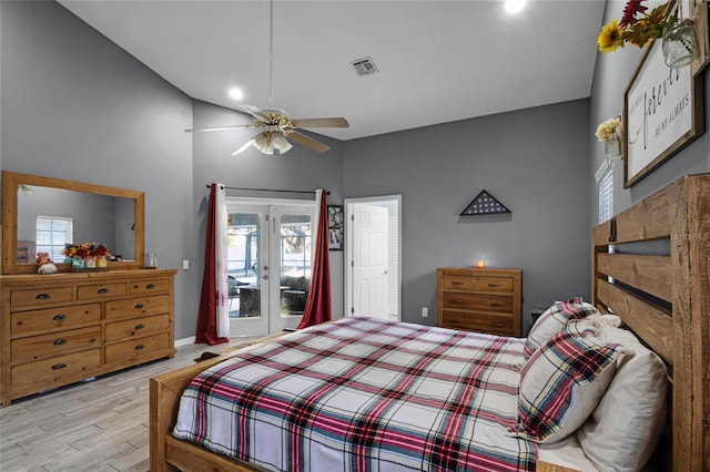 bedroom featuring light hardwood / wood-style flooring, french doors, ceiling fan, and access to outside