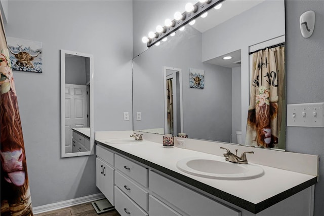 bathroom with vanity and toilet