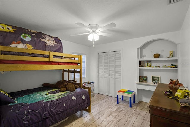 bedroom featuring a closet, ceiling fan, and light hardwood / wood-style flooring