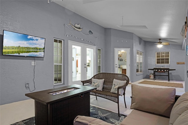 living room featuring french doors and lofted ceiling