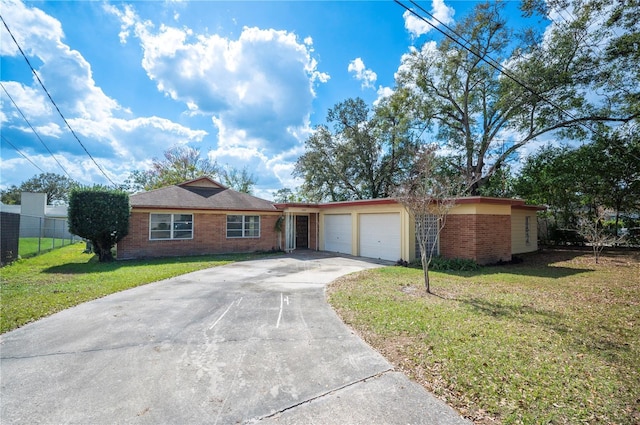 single story home with a garage and a front yard