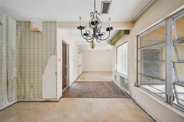 unfurnished dining area with an inviting chandelier