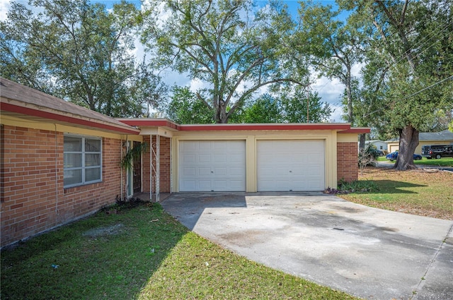 garage featuring a yard