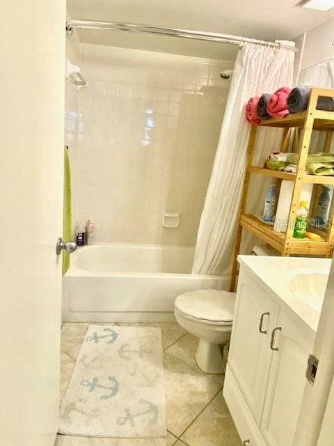 full bathroom featuring tile patterned floors, vanity, toilet, and shower / bath combo with shower curtain