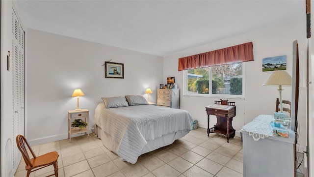 bedroom featuring light tile patterned flooring