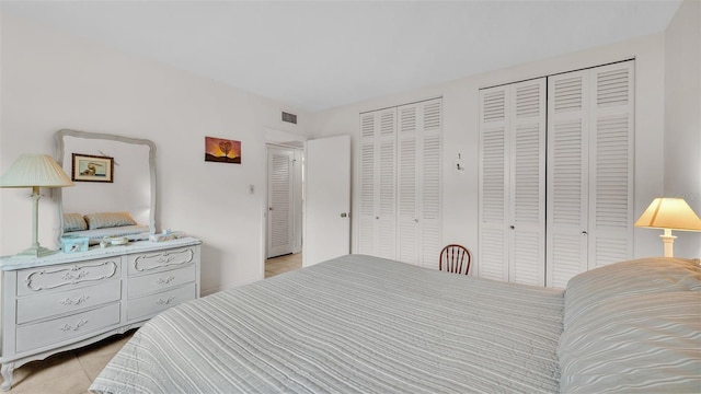 bedroom with two closets