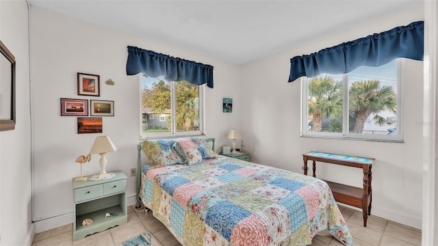 bedroom featuring light tile patterned flooring