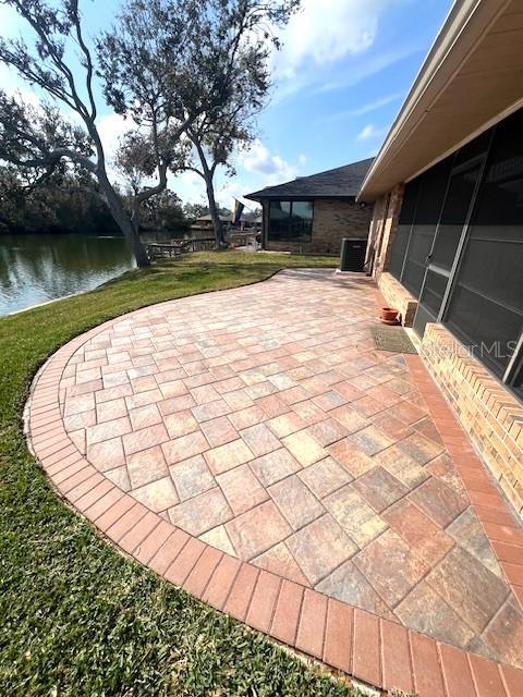 view of patio with a water view