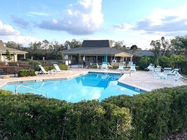 view of swimming pool with a patio