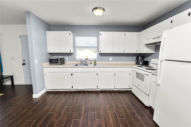 kitchen with white cabinetry, white appliances, and sink