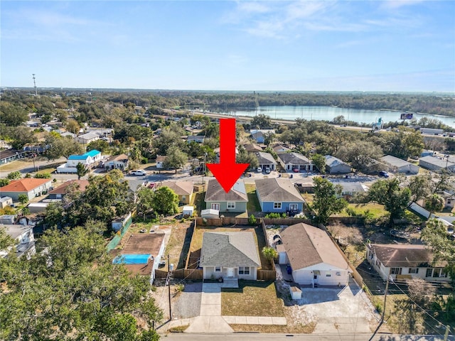 birds eye view of property featuring a water view