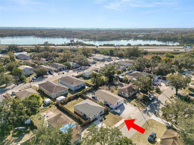 birds eye view of property featuring a water view