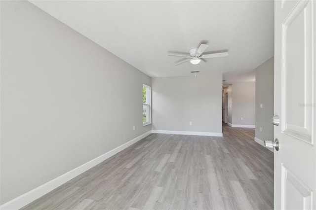 spare room featuring ceiling fan and light hardwood / wood-style flooring