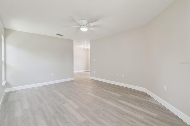 unfurnished room with ceiling fan and light hardwood / wood-style floors