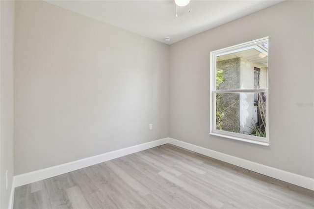 empty room with light hardwood / wood-style flooring