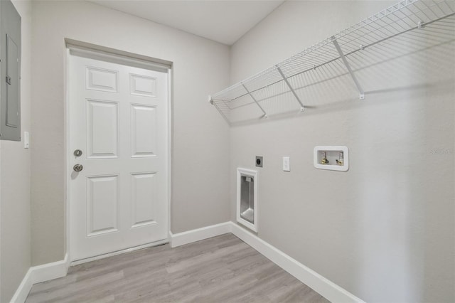 laundry area with washer hookup, hookup for an electric dryer, electric panel, and light wood-type flooring