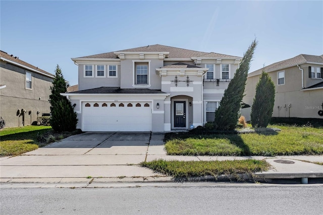 front facade with a garage and a front lawn