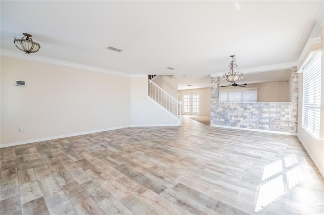 unfurnished living room with ornamental molding and light hardwood / wood-style floors