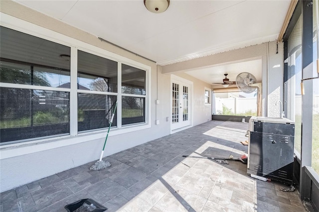 view of patio with french doors and ceiling fan