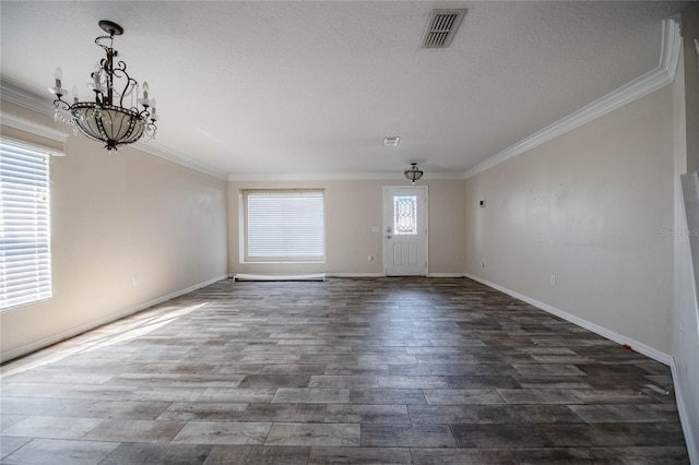 interior space featuring dark wood-style floors, visible vents, and ornamental molding