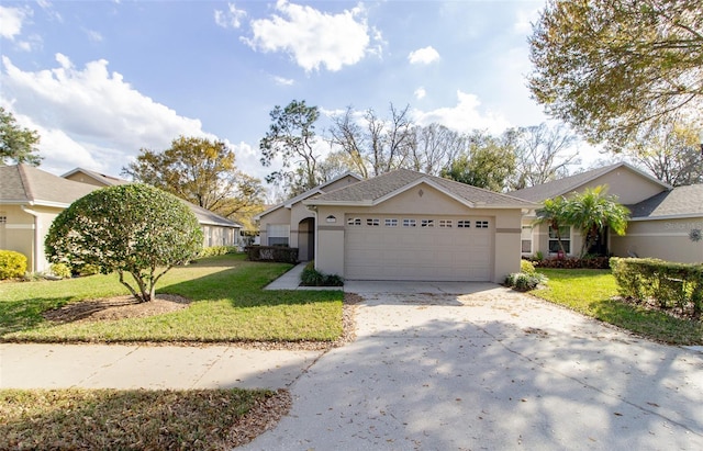 view of front of home with a garage and a front yard