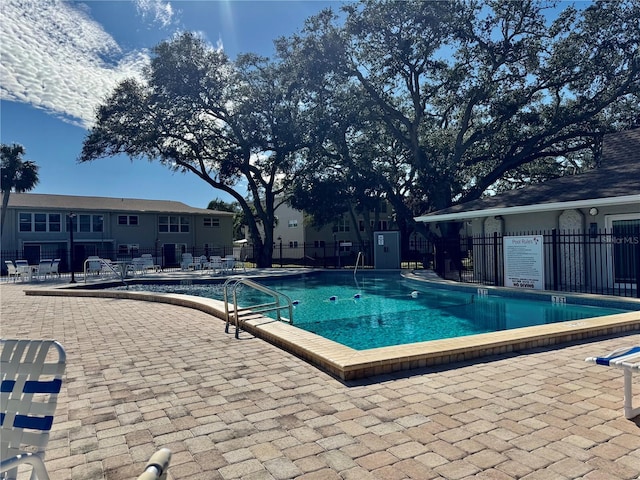 view of swimming pool featuring a patio area