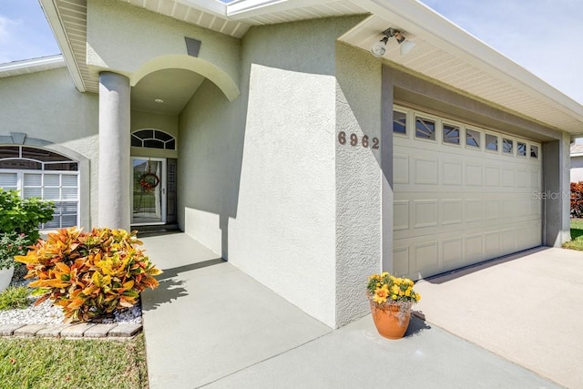 doorway to property featuring a garage