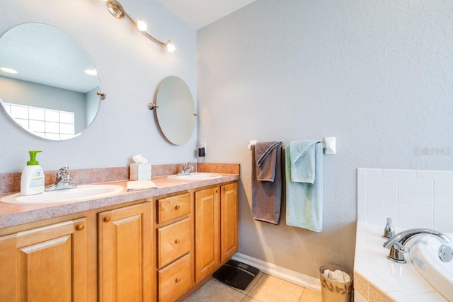 bathroom featuring vanity, a tub, and tile patterned floors