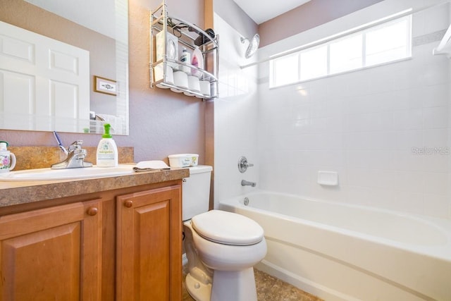 full bathroom with vanity, washtub / shower combination, and toilet