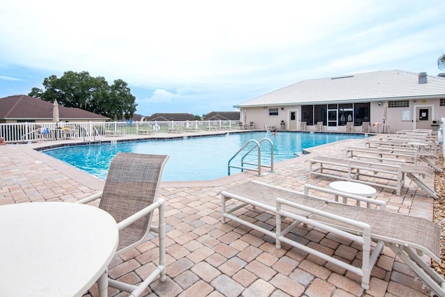 view of swimming pool featuring a patio