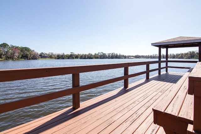 dock area with a water view and a gazebo