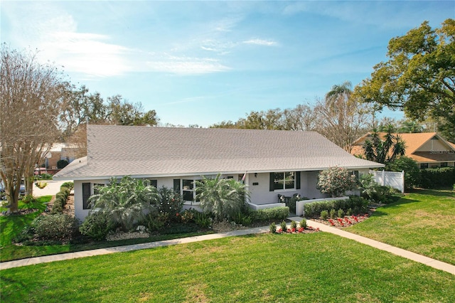 ranch-style house featuring a front lawn