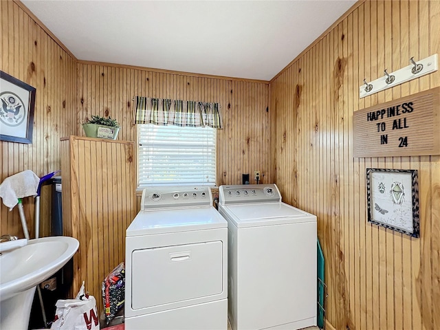 laundry room featuring washing machine and clothes dryer and sink