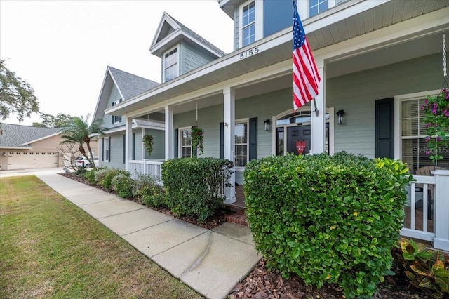 view of front of house with a front yard and covered porch