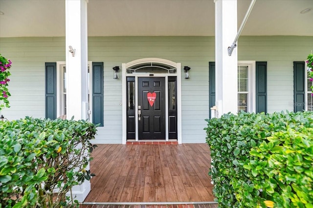 property entrance featuring covered porch