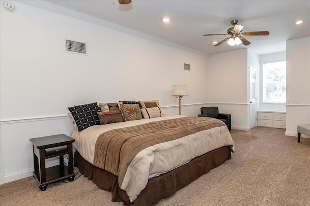 bedroom featuring light colored carpet, visible vents, baseboards, and recessed lighting