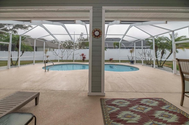 view of swimming pool featuring a patio, a fenced backyard, a fenced in pool, and a lanai