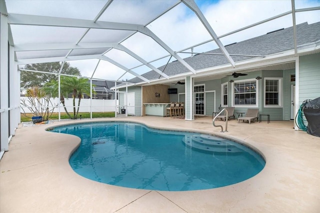 view of swimming pool featuring ceiling fan, a patio, a lanai, fence, and a fenced in pool