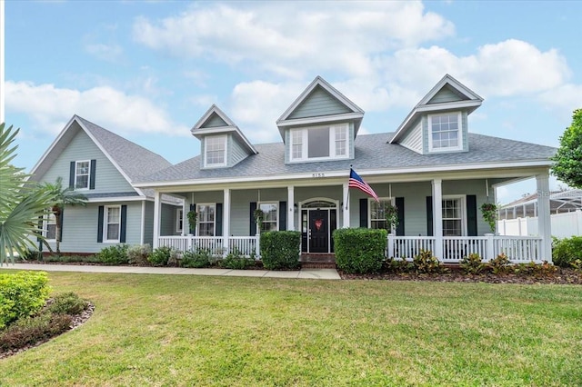 view of front of house with a porch and a front lawn