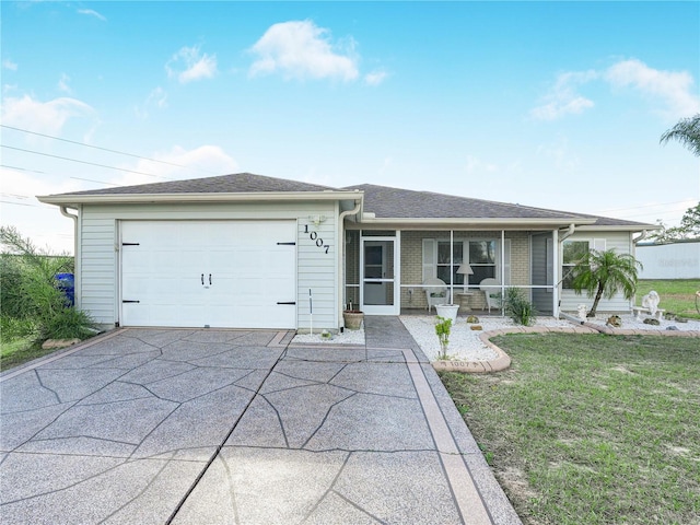 single story home featuring a garage, a front lawn, and a sunroom