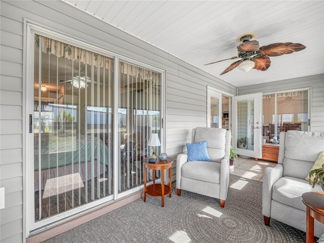 sunroom / solarium with ceiling fan and a healthy amount of sunlight