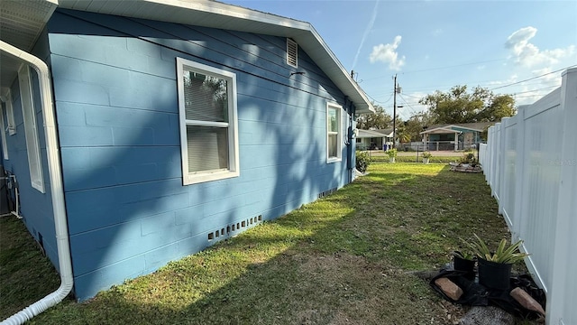 view of home's exterior featuring a yard