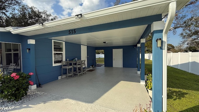 view of patio / terrace with a carport