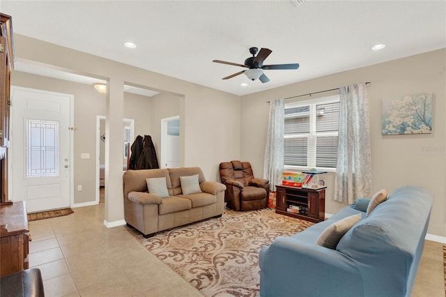 tiled living room featuring ceiling fan