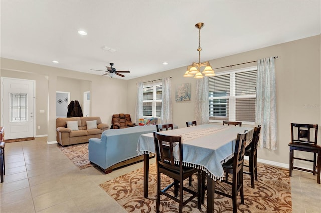 tiled dining room featuring ceiling fan