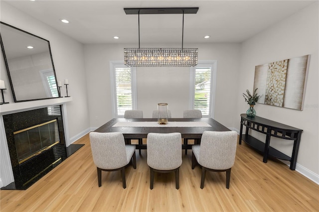 dining room with plenty of natural light and light hardwood / wood-style floors