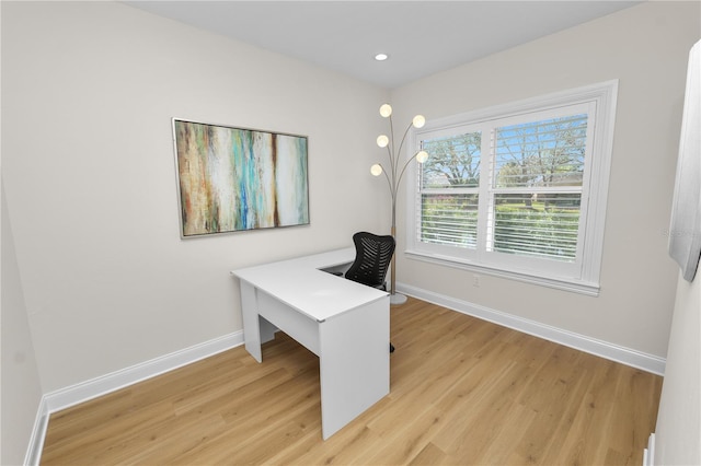 office with light wood-type flooring