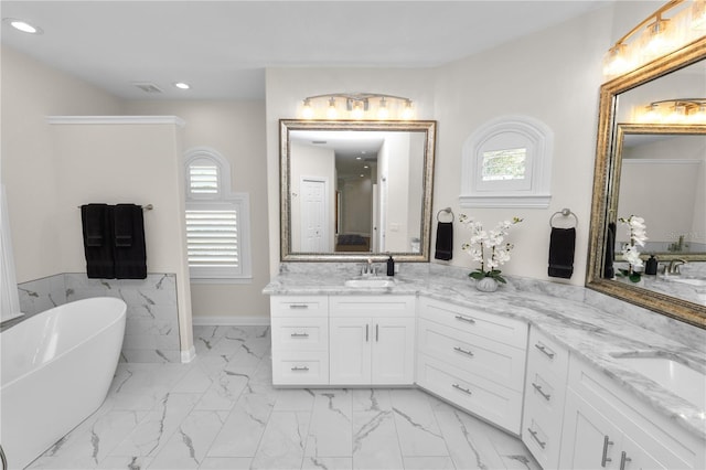 bathroom featuring vanity and a bathtub